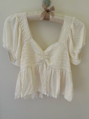 Urban Outfitters “Angelo” Smocked Babydoll Blouse in Cream 
Size: Small
NWOT